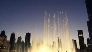 Moments of wonder at Dubai Fountain Show: People captivated by the dazzling display, embracing the magic of the moment.